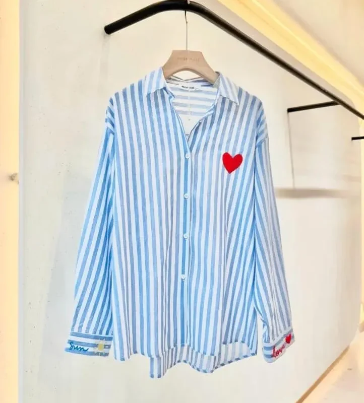 Blusa con bordado sol